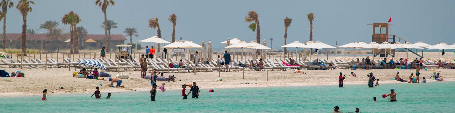 Al Jazaira Beach which includes a beach, general coastal views and swimming