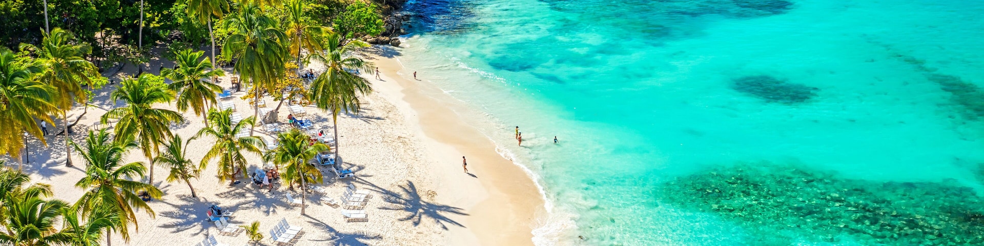 Aerial drone view of the beautiful small island and palm trees of Atlantic Ocean. Cayo Levantado island, Samana, Dominican Republic