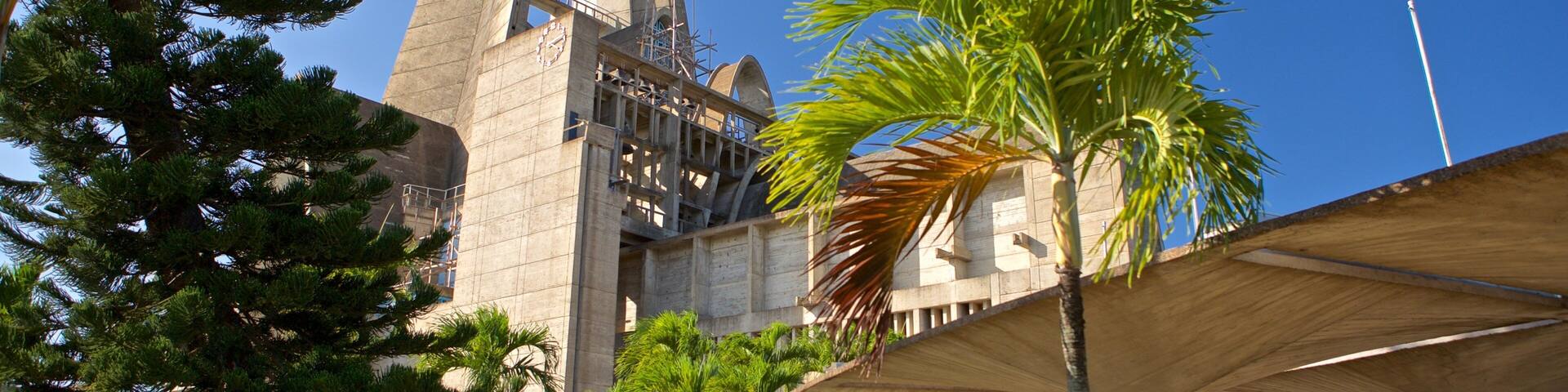 La Altagracia Cathedral showing modern architecture as well as a couple