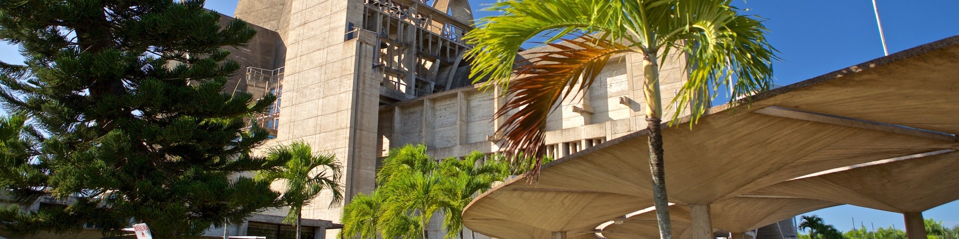 La Altagracia Cathedral showing modern architecture as well as a couple