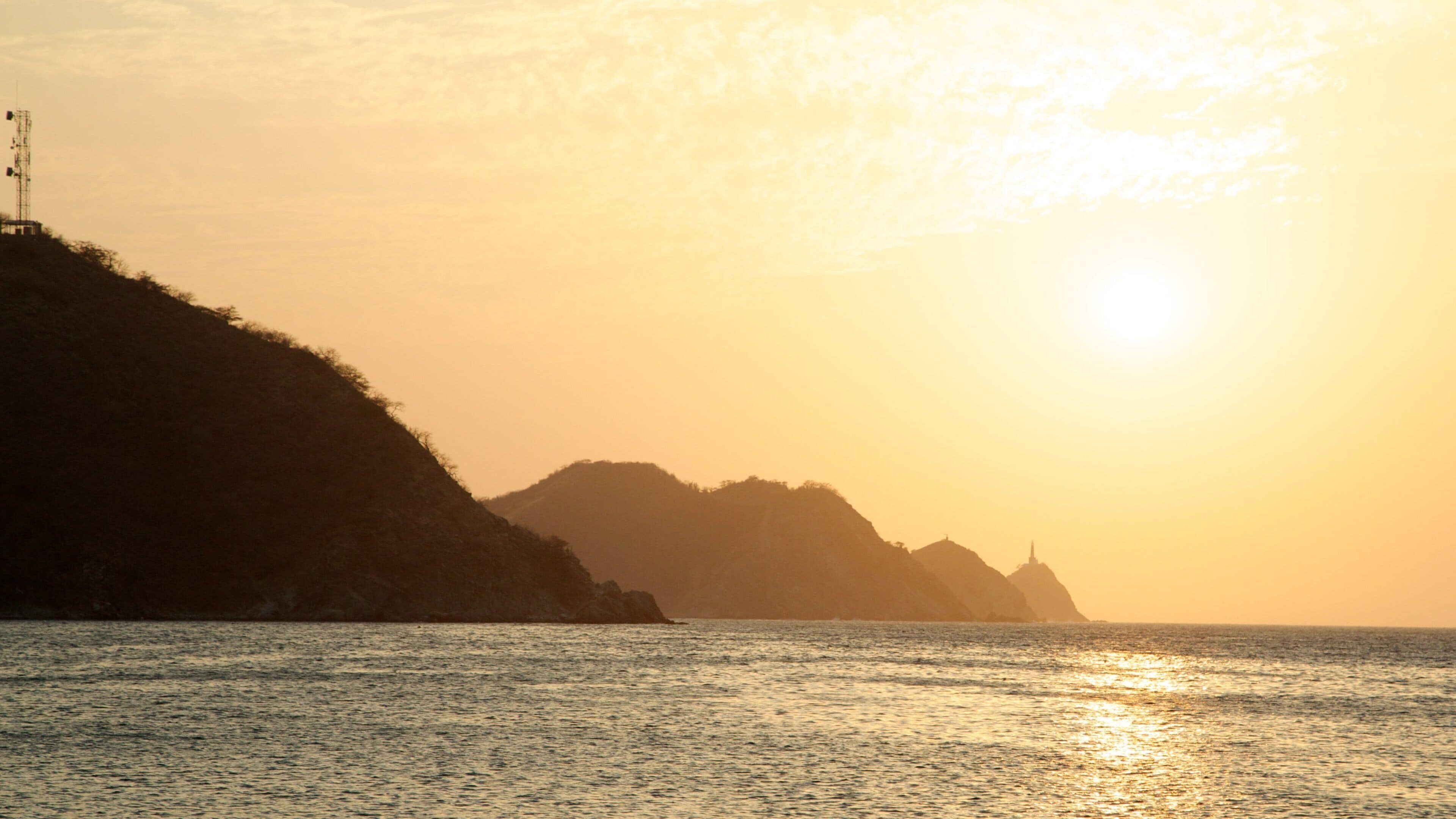 Taganga Beach showing general coastal views, a sunset and landscape views