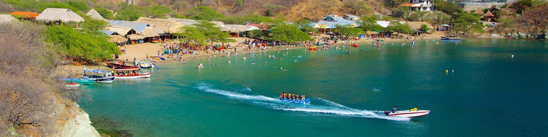 Taganga Beach which includes a beach, boating and a bay or harbor