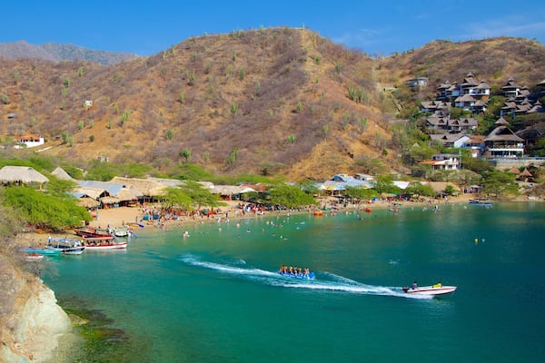 Taganga Beach featuring a coastal town, a bay or harbour and landscape views