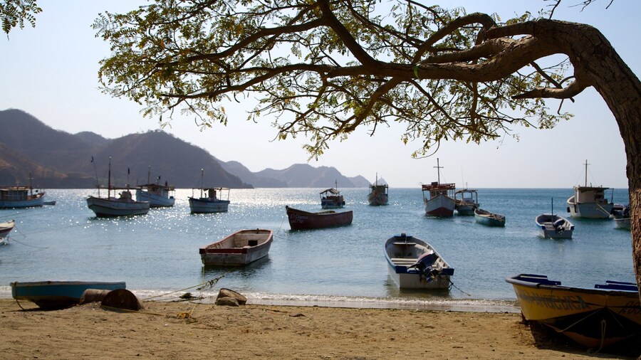 Taganga Beach featuring a sandy beach, a bay or harbour and boating