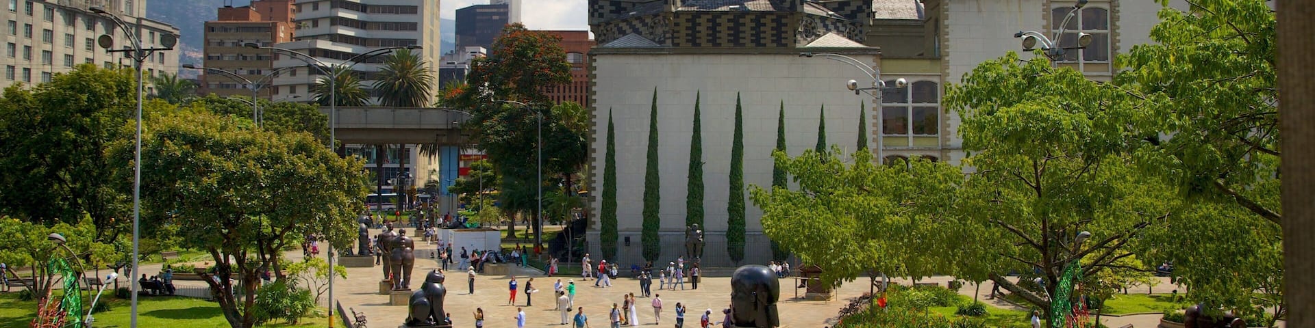 Botero Square Sculpture Park featuring a church or cathedral, a square or plaza and a city