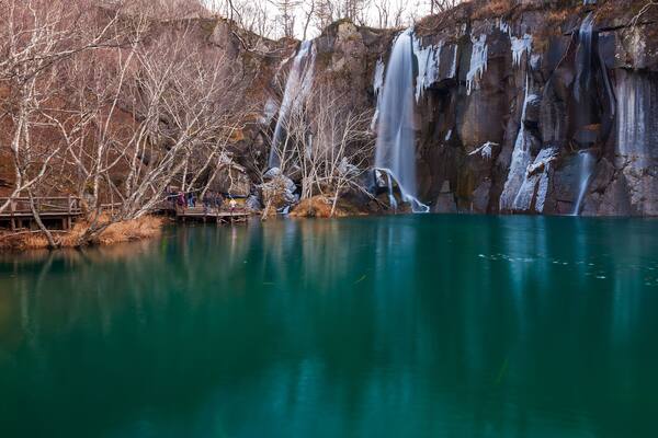 Waterfalls and green pool.The image taken in china`s jilin province, baishan city, changbai mountain scenic spot.The waterfalls white and water green, was cool world.