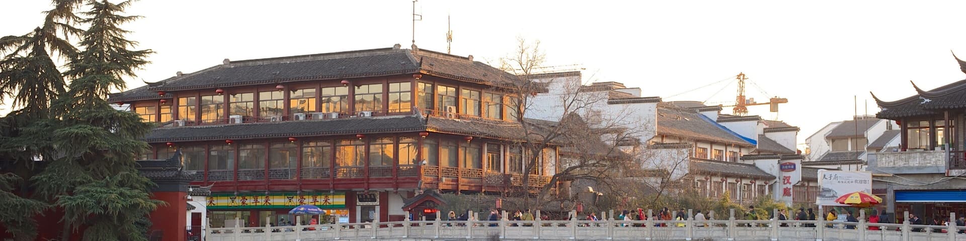 Temple of Confucius showing a temple or place of worship, a city and a sunset