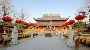 Temple of Confucius which includes a statue or sculpture, a temple or place of worship and religious aspects