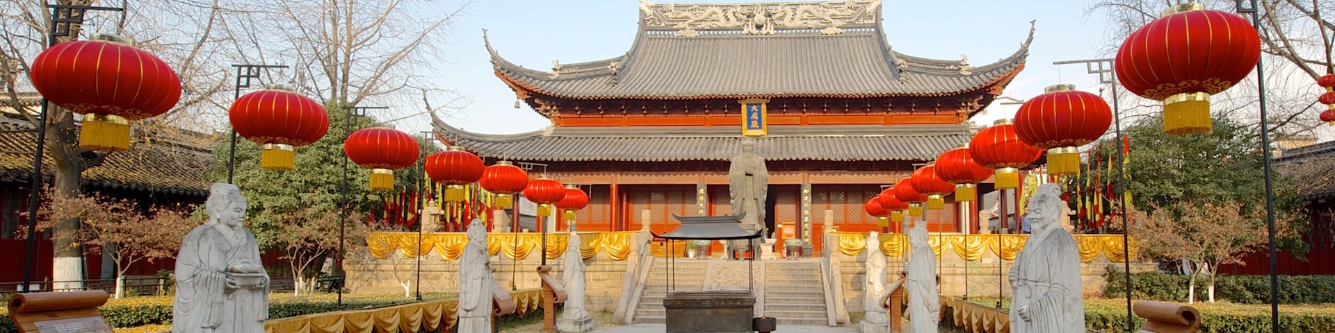 Temple of Confucius which includes a statue or sculpture, a temple or place of worship and religious aspects