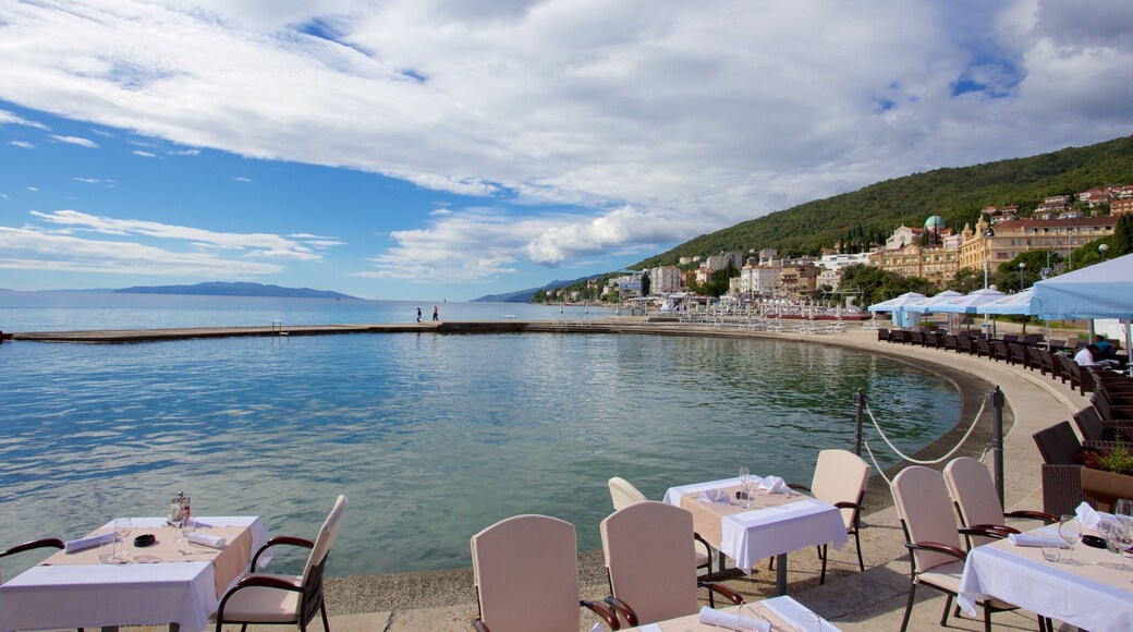Slatina Beach showing a coastal town and outdoor eating