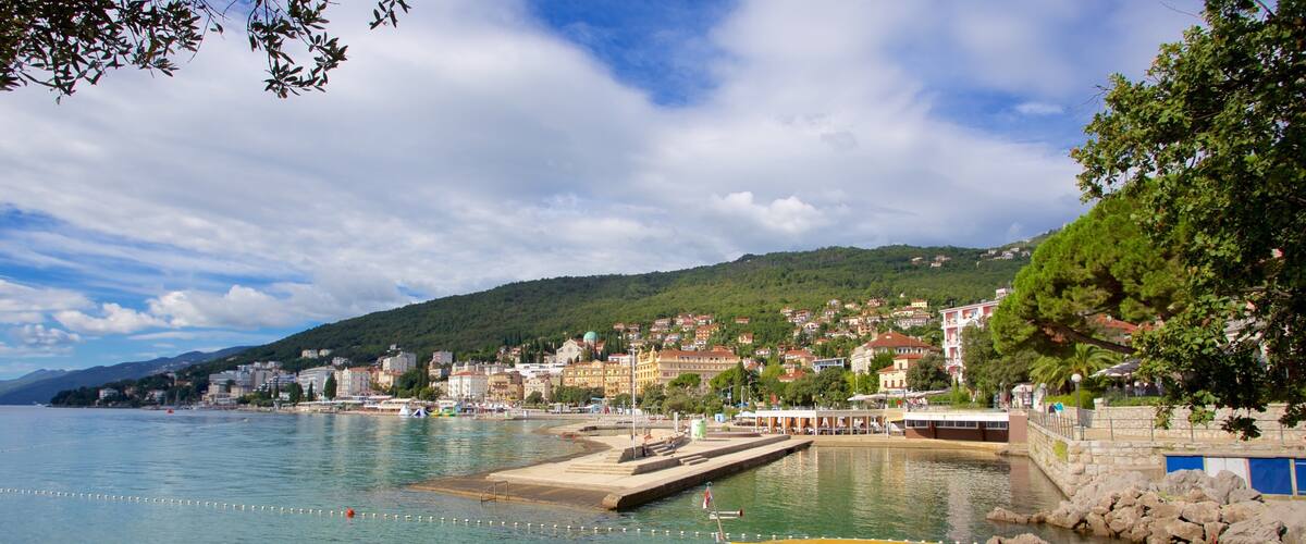 Slatina Beach featuring a coastal town and a bay or harbor