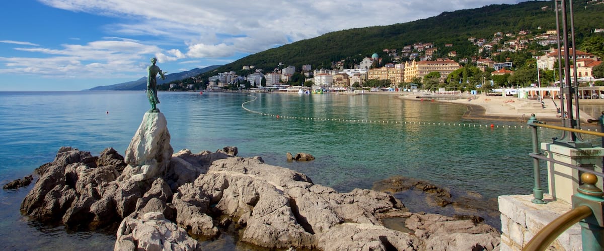 Slatina Beach featuring a statue or sculpture and general coastal views