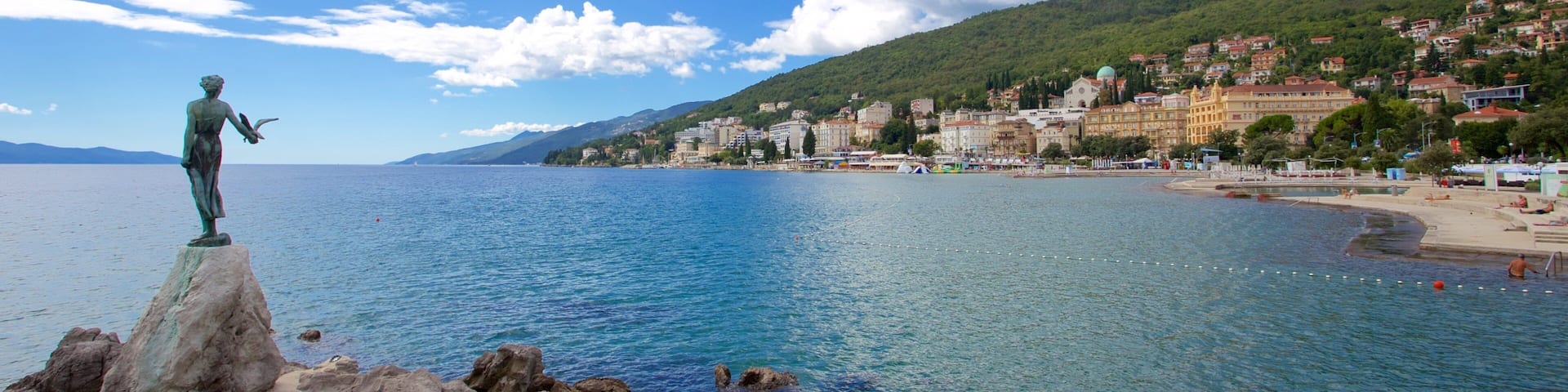 Slatina Beach featuring a statue or sculpture and general coastal views
