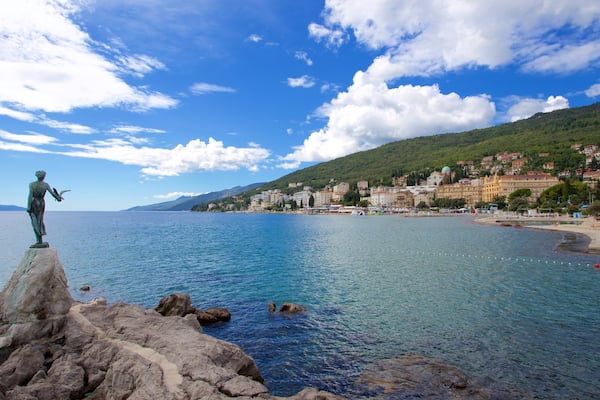 Slatina Beach featuring a statue or sculpture and general coastal views