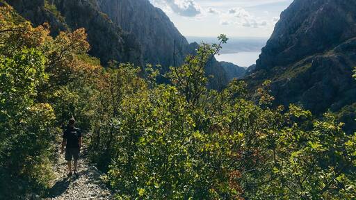 Hiking trail with stunning Adriatic Sea views coming down the mountain