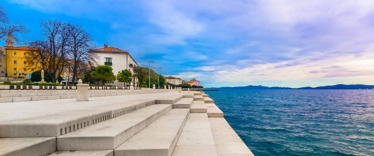 Zadar coastline Sea Organ. / Scenic view at coastal town Zadar and famous landmark on city promenade, Sea Organ, Croatia Europe.