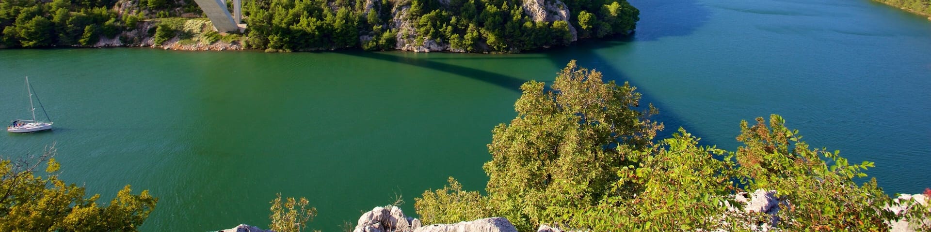 Krka National Park which includes a bridge and a river or creek