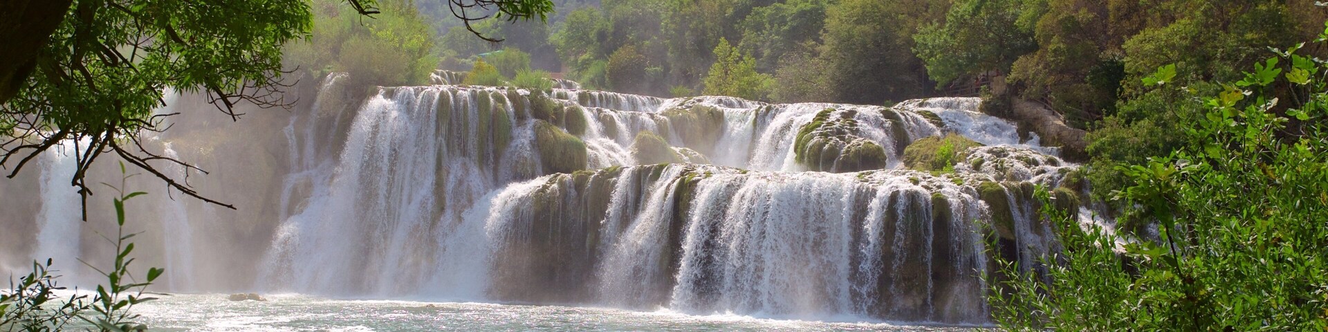 Krka National Park which includes a lake or waterhole and rapids as well as an individual male