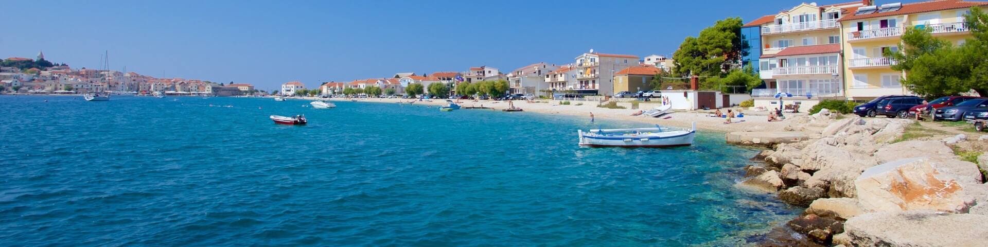 Primosten Beach showing a coastal town and rugged coastline