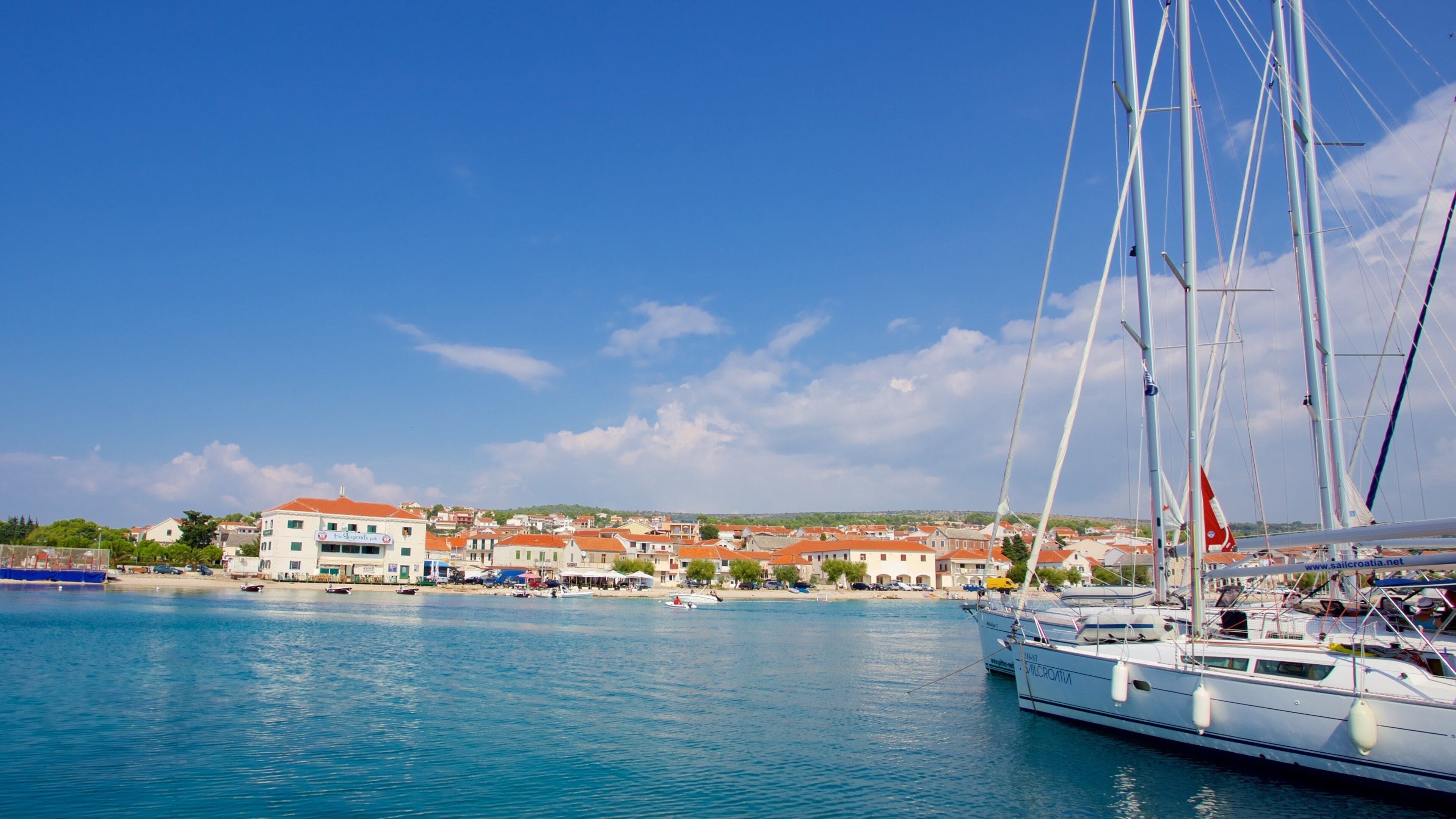 Primosten Beach featuring a marina