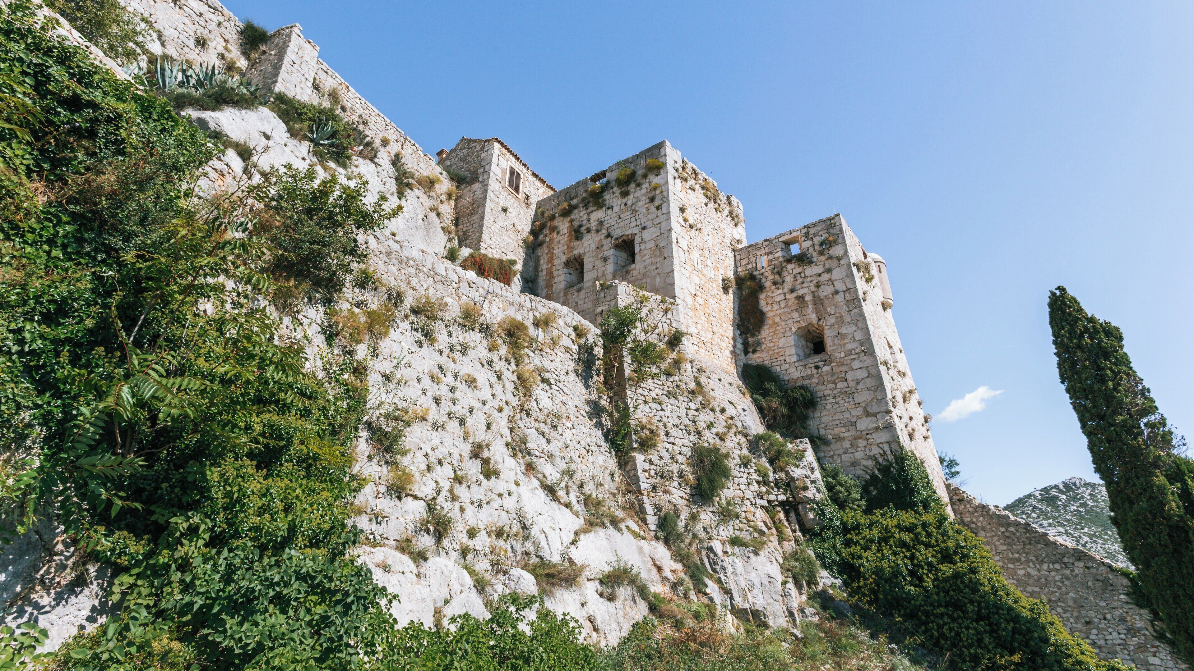 Explore historic Klis Fortress situated near Split, Croatia, offering stunning views and a glimpse into medieval architecture and history