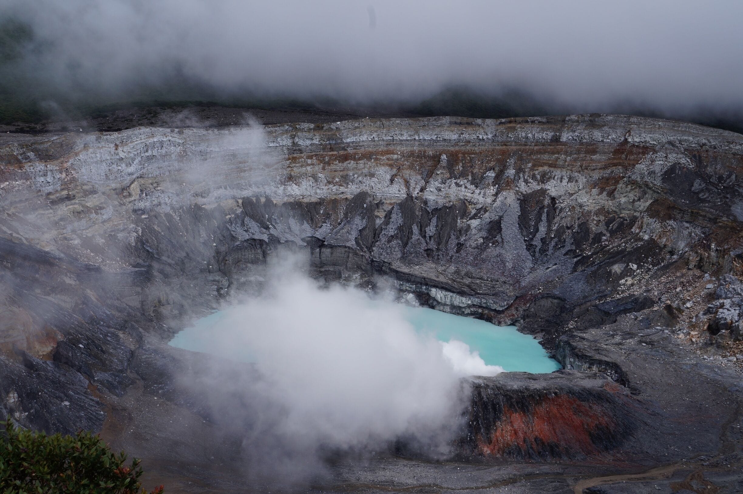 Poás is one of Costa Rica´s most active volcanoes, and the rain-fed sulphuric pool emits smoke and steam. 

The weather here can change in an instant, so make sure to take photos quickly if you have a clear view of the crater. 10 minutes after I took this photo, clouds and fog covered the area and completely obstructed the view. 