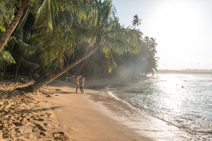 Couple at paradise wild beach of Manzanillo Park in Costa Rica; Shutterstock ID 448685533