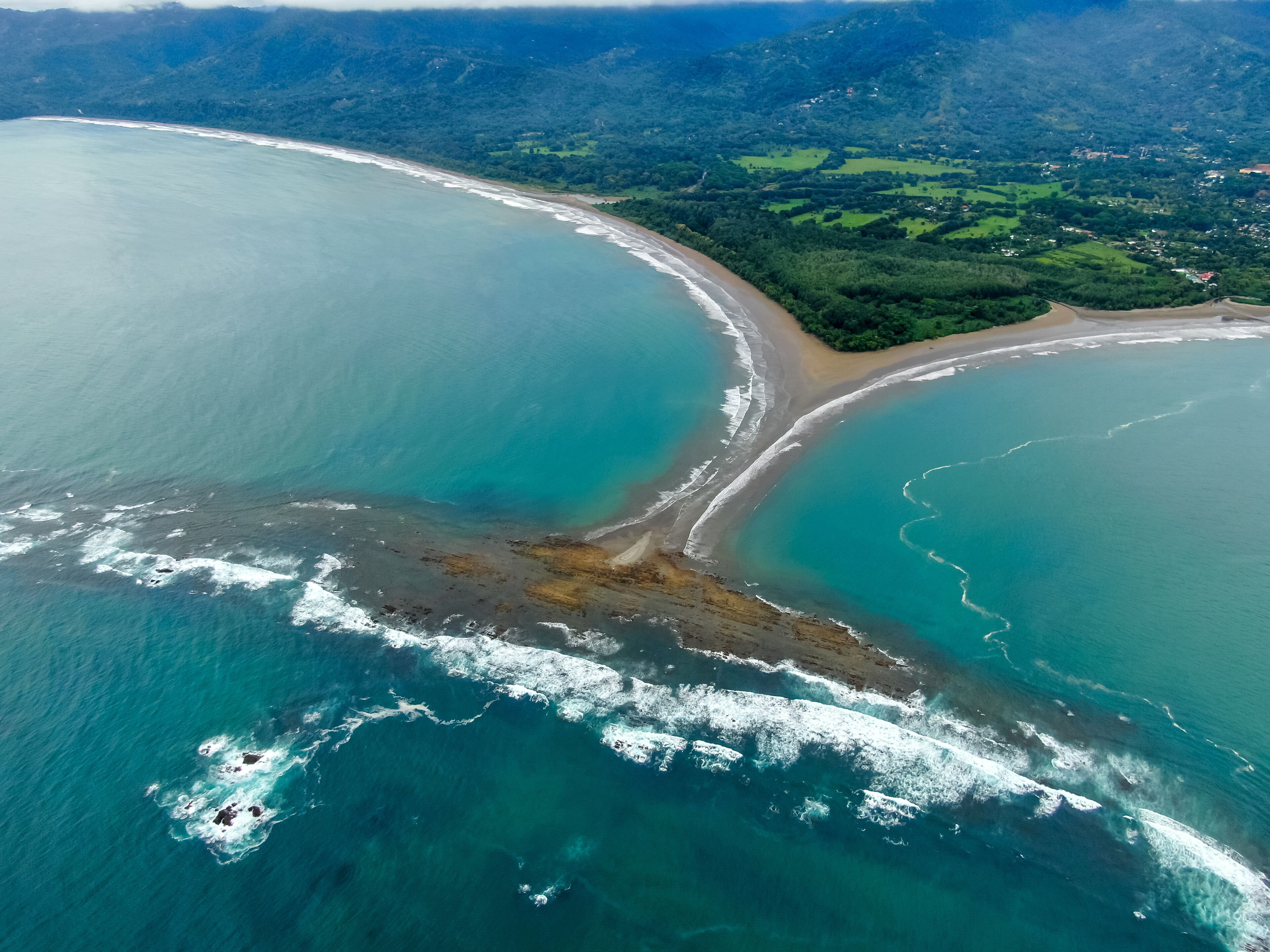 Beautiful aerial view of the majestic whale tale in the beach of the National park Marino Ballena in Costa Rica 