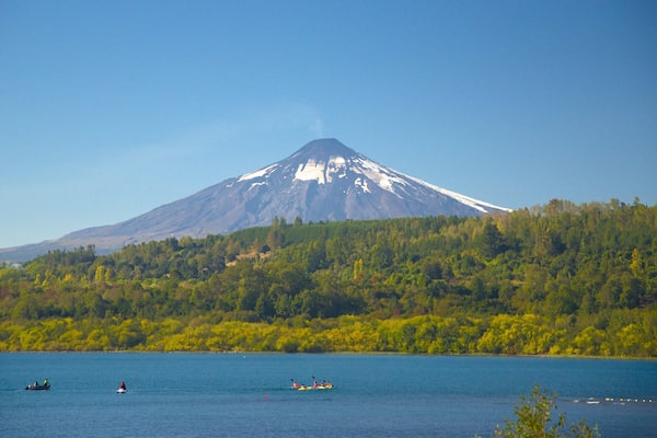 Lake Villarrica which includes a lake or waterhole, mountains and forest scenes