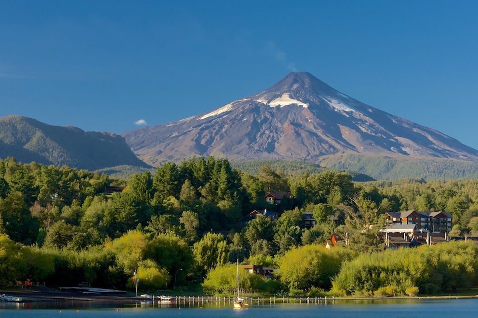 A lake with a mountain in the background.