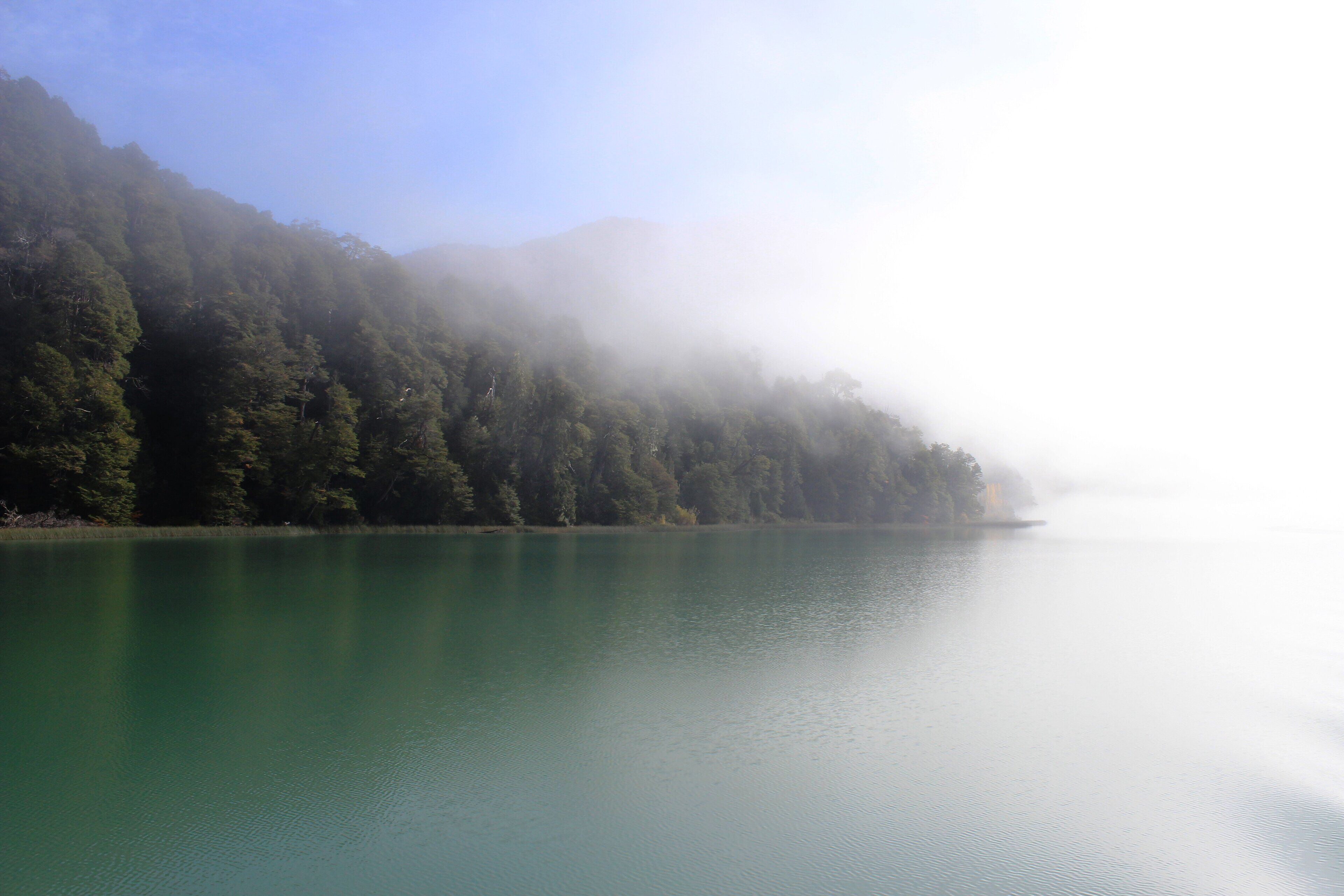 Caption---- fog over Todos Los Santos Lake, Puerto Varas, Los Lagos region, Chile