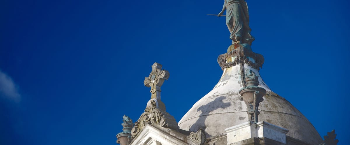 Punta Arenas Cemetery featuring religious elements, a statue or sculpture and heritage elements
