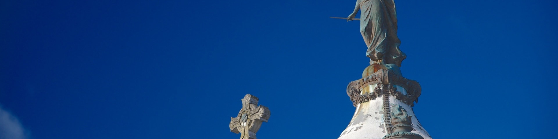 Punta Arenas Cemetery featuring religious elements, a statue or sculpture and heritage elements