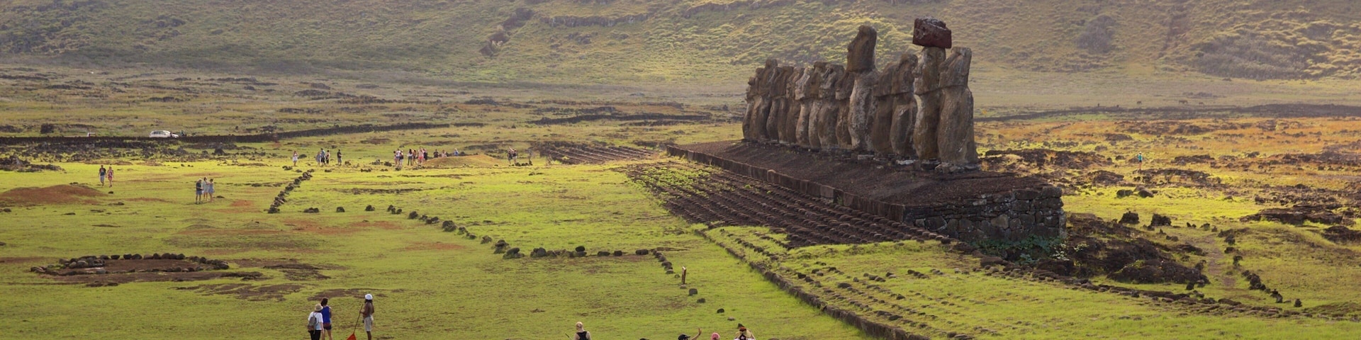 Ahu Tongariki which includes heritage elements and tranquil scenes as well as a small group of people