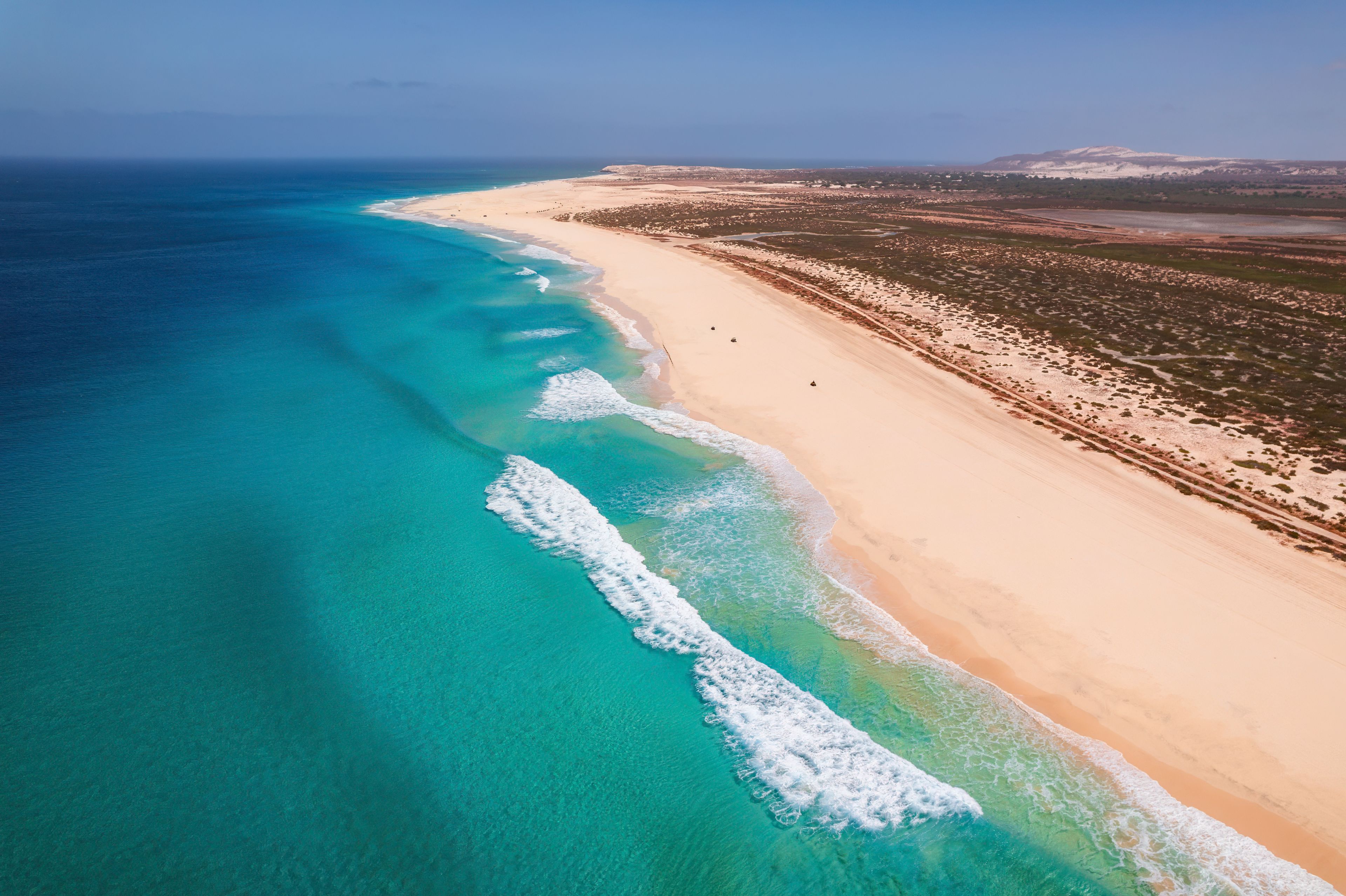 Beautiful tropical beach on Boa Vista Island, Cape Verde, featuring golden sand, clear turquoise water, and a sunny blue sky – ideal travel and vacation destination