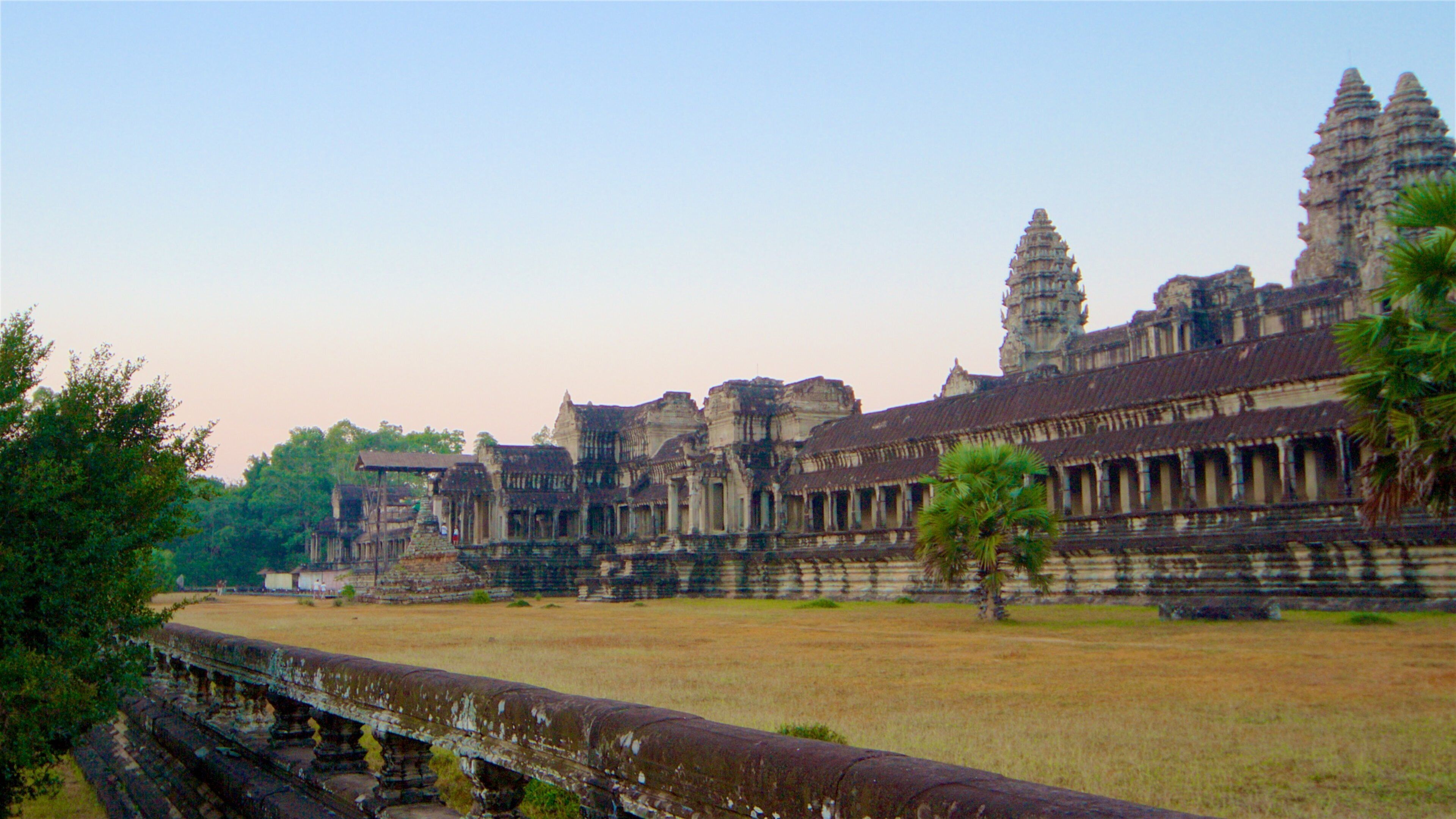 Angkor Wat showing heritage architecture, a temple or place of worship and a sunset