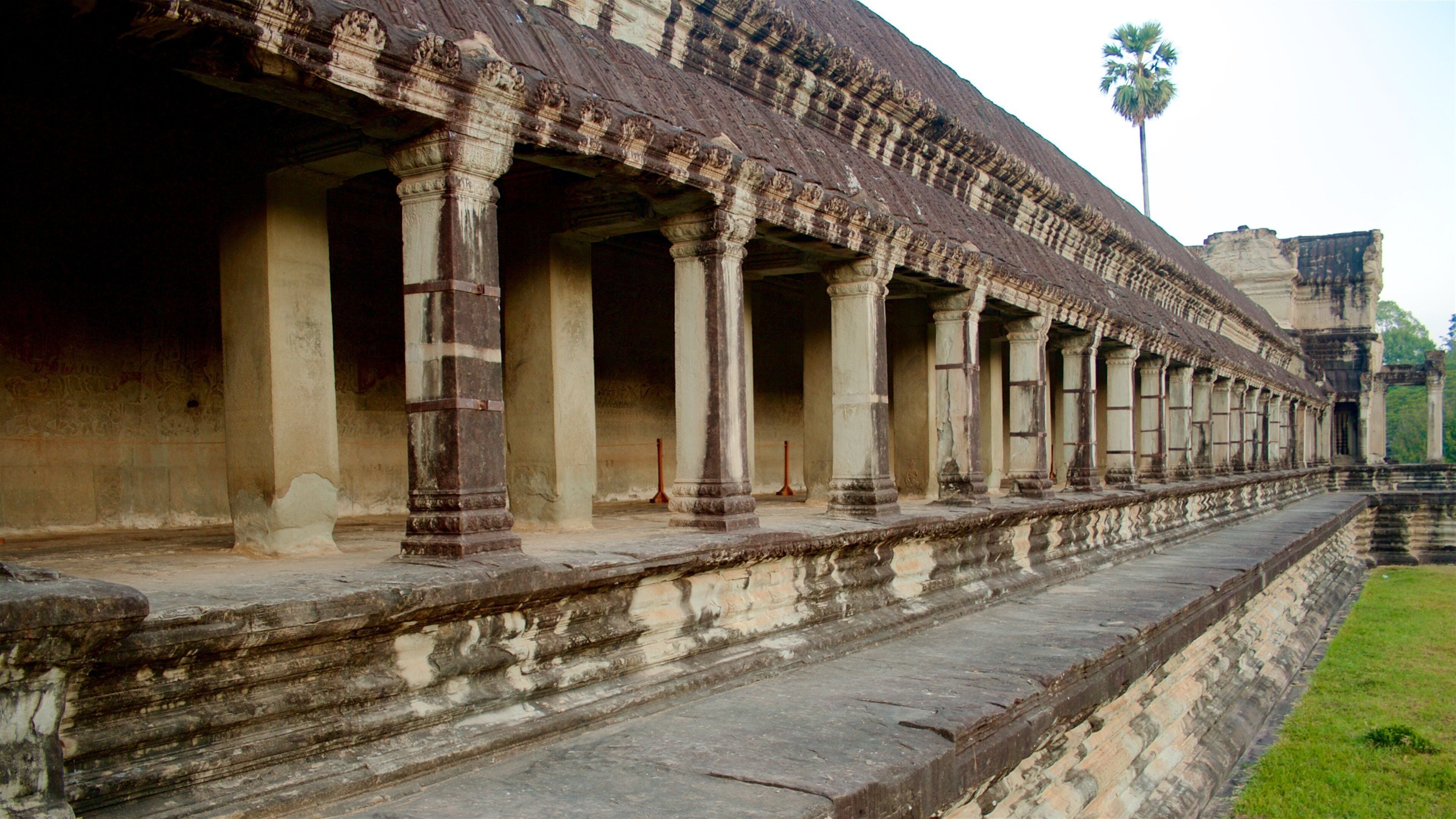 Angkor Wat which includes a temple or place of worship and heritage elements