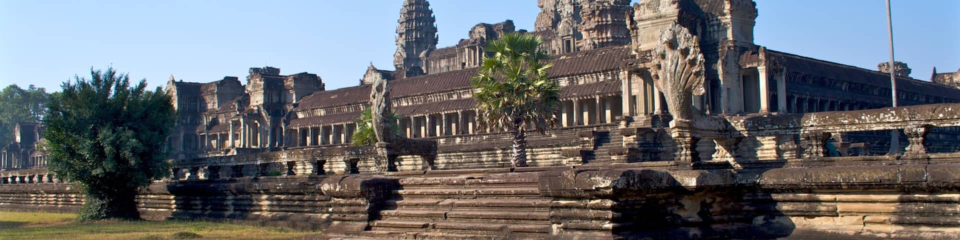 Angkor Wat temple complex with its intricate stone carvings and tiered towers.