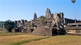 Angkor Wat temple complex with its intricate stone carvings and tiered towers.