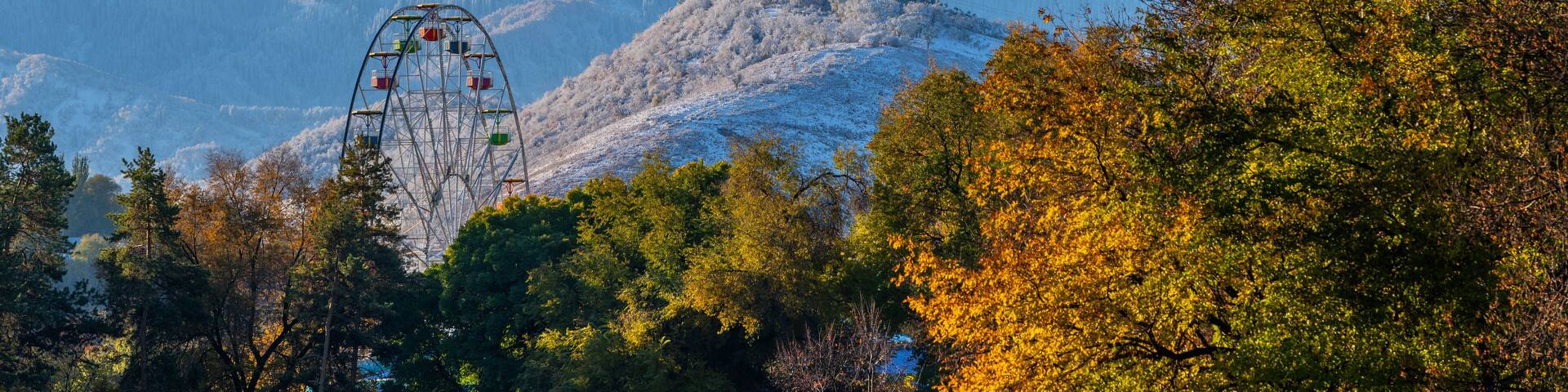 View of snow-capped mountains in the Kazakh city of Almaty on an autumn morning