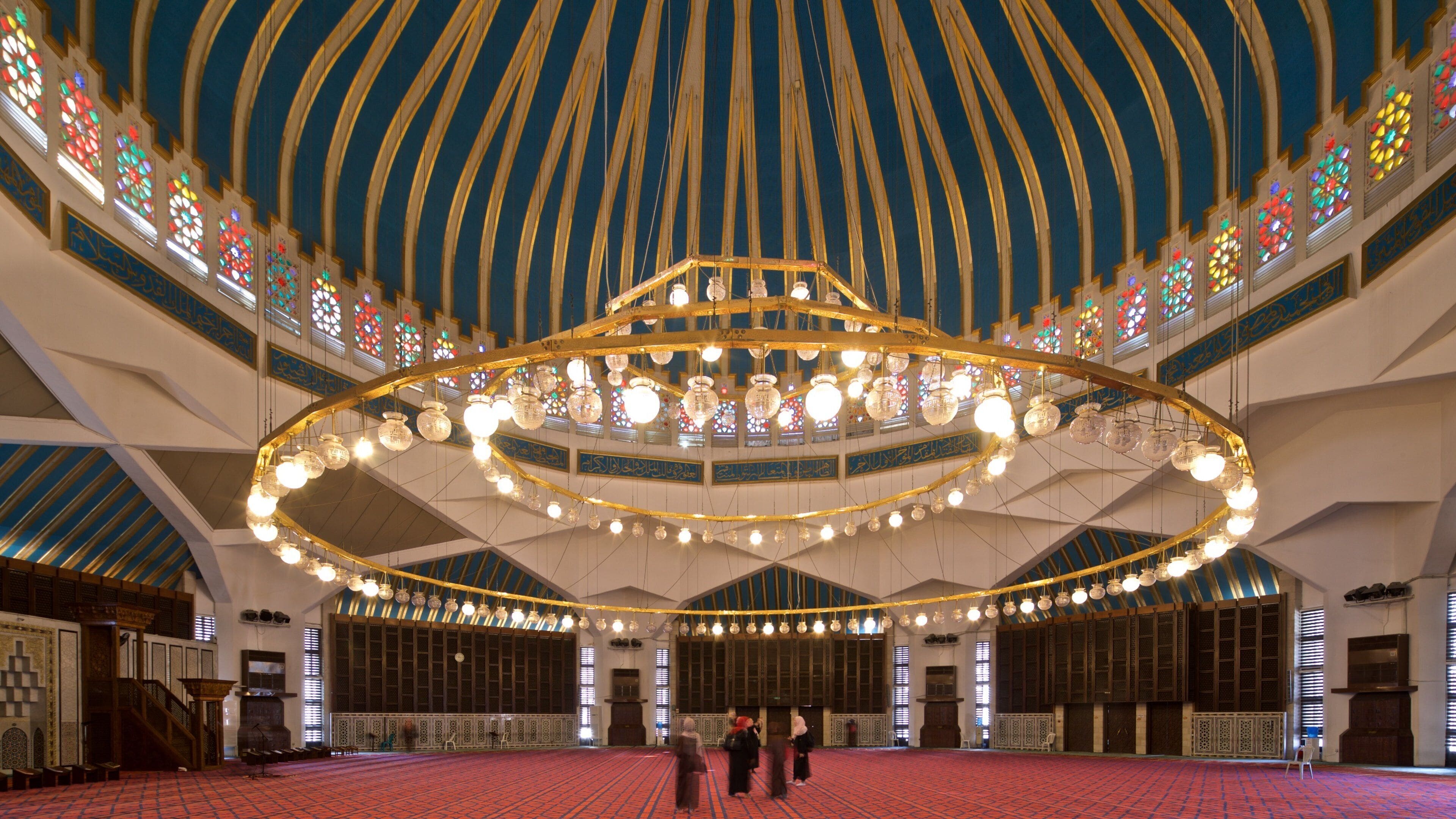 King Abdullah I Mosque featuring interior views and heritage elements as well as a small group of people