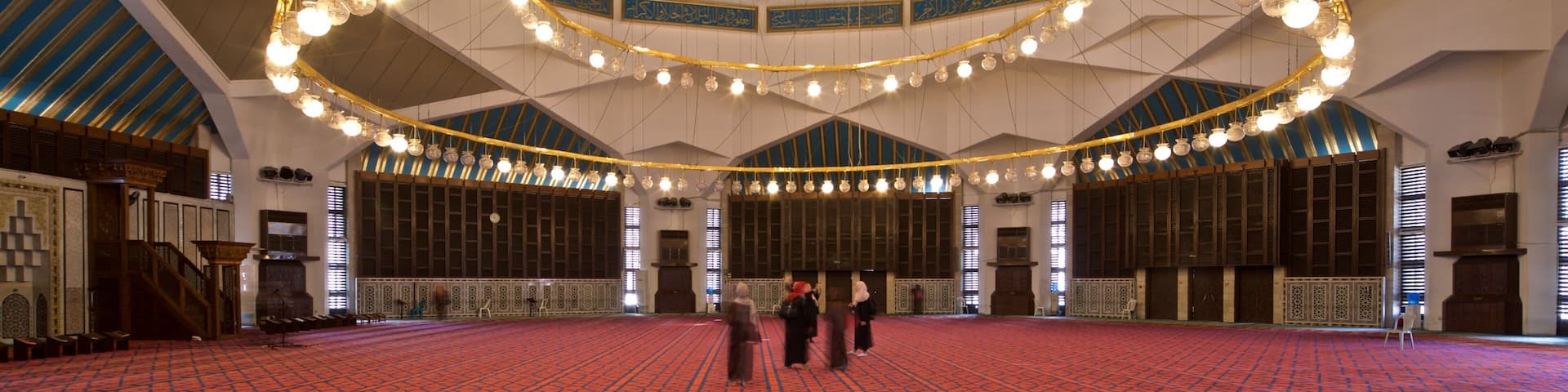 King Abdullah I Mosque featuring interior views and heritage elements as well as a small group of people