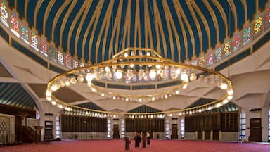 King Abdullah I Mosque featuring interior views and heritage elements as well as a small group of people