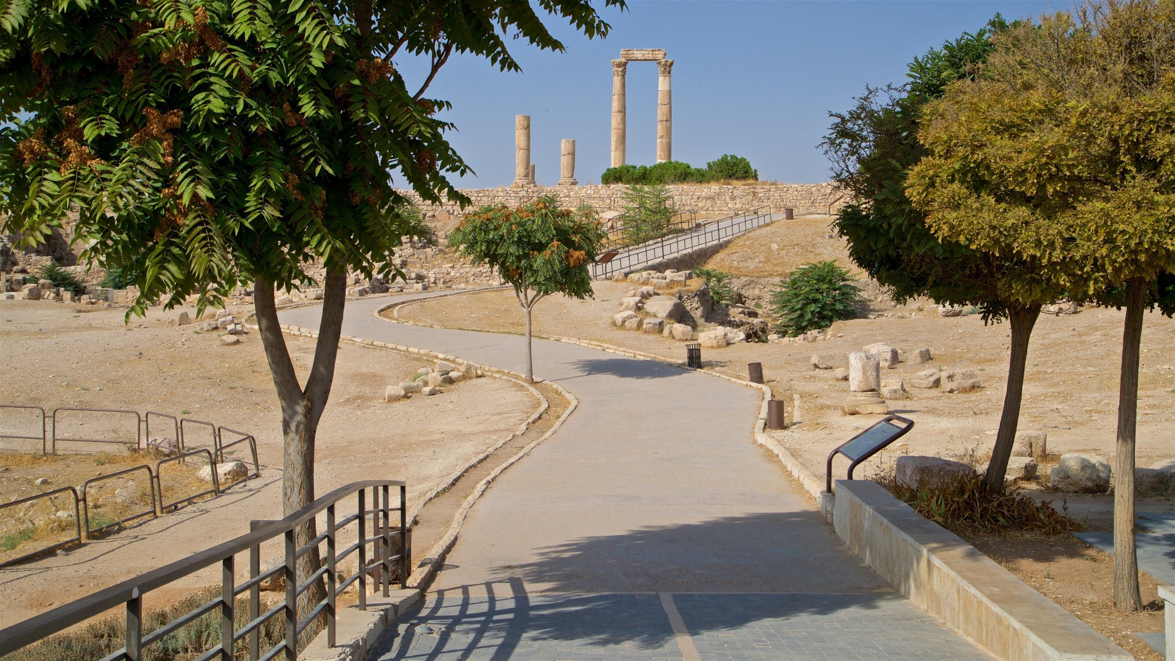 Temple of Hercules featuring heritage elements and a garden