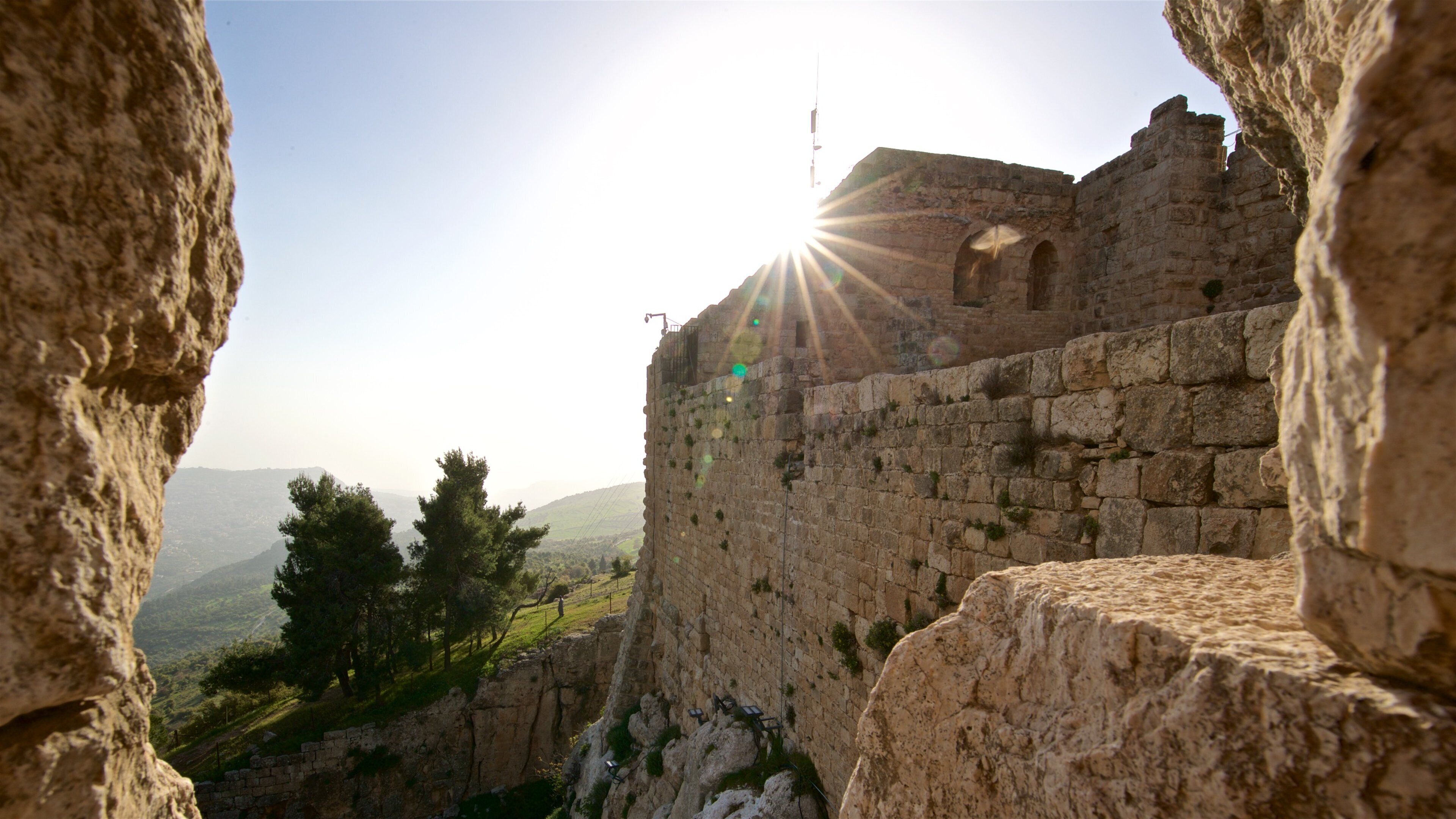 Ajloun Castle showing heritage elements and a sunset