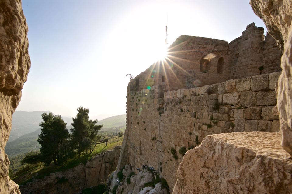 A stone fortress with a view of the surrounding landscape.