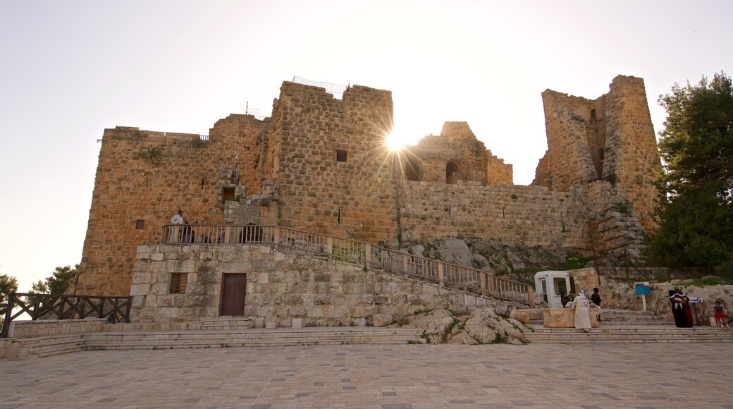 Ajloun Castle showing heritage architecture and a sunset