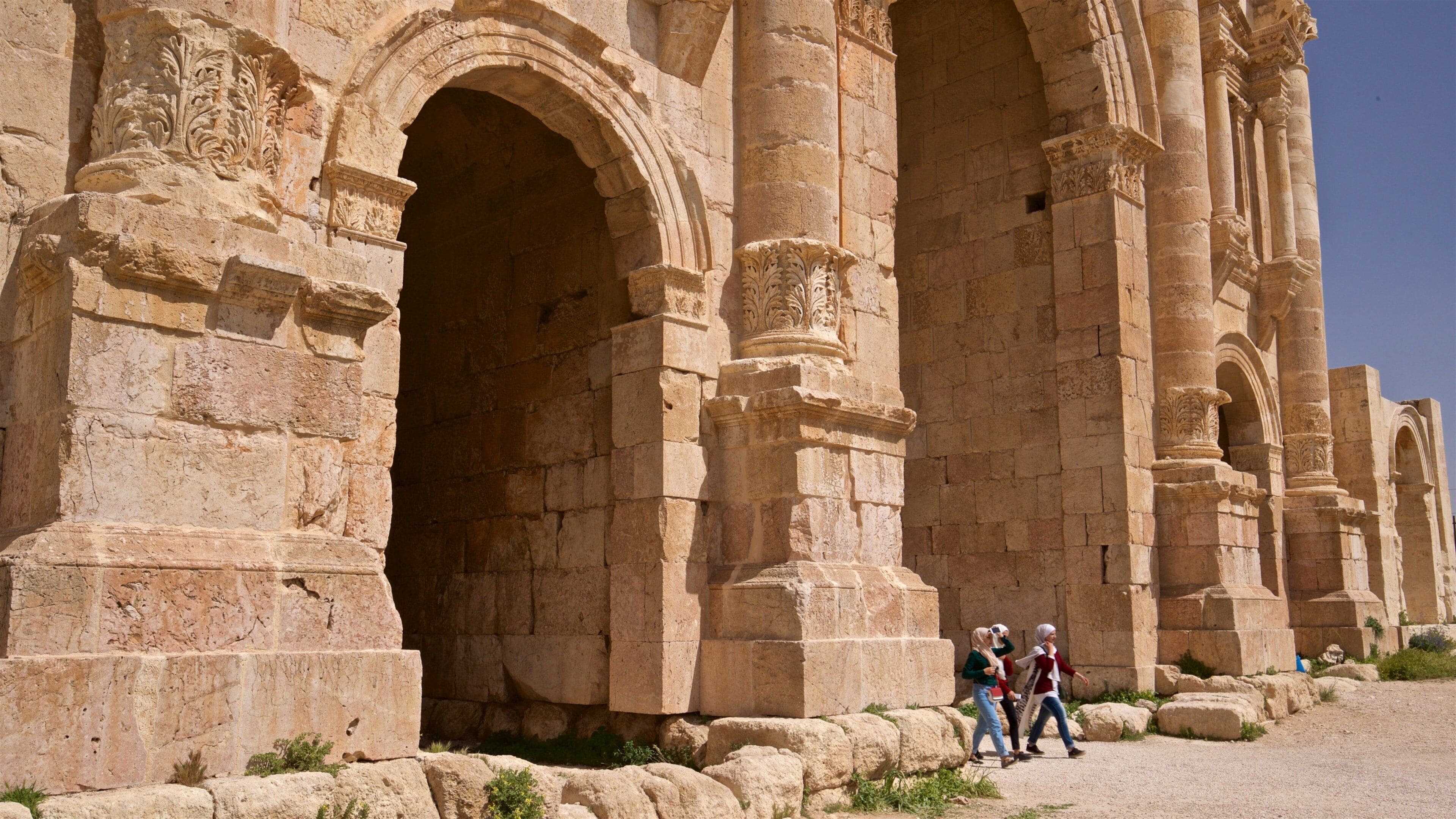 Hadrian\'s Arch which includes heritage architecture as well as a small group of people