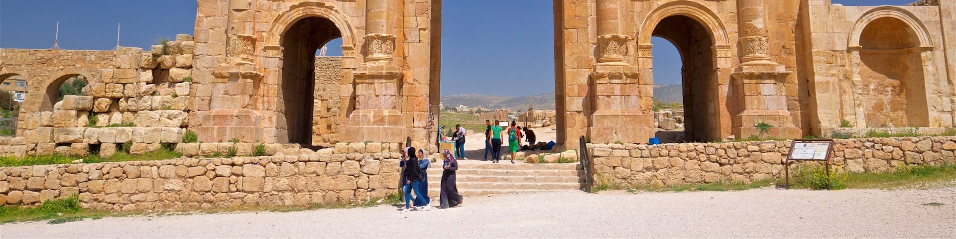 Hadrian\'s Arch which includes heritage architecture as well as a small group of people
