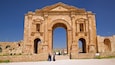 Hadrian\'s Arch which includes heritage architecture as well as a small group of people